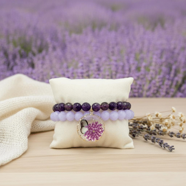 The Fiore di Speranza bracelet is a symbol of hope, healing, and transformation. Handcrafted with radiant amethyst beads, each stone carries calming and spiritual energy, long associated with clarity, protection, and peace. The design is elevated by a stunning pendant featuring a delicate pressed lavender flower and butterfly motif, celebrating the beauty of nature and renewal of the soul. More than a bracelet, it is a wearable reminder to embrace hope and cherish life’s meaningful moments. With every purchase, a portion of the proceeds is donated to the Stephanie Nicole Parze Foundation, supporting their vital mission to spread awareness, advocacy, and healing for those affected by domestic violence and abuse.