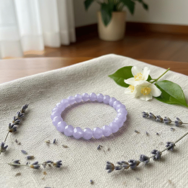 The Lavanda bracelet is a gentle expression of peace and elegance. Handcrafted with faceted lavender-hued stones, this bracelet captures the soft light of serenity and the natural calm of blooming fields. Each bead reflects harmony and grace, designed for those who seek tranquility in everyday moments. Its delicate lavender tones make it a versatile piece — equally beautiful on its own or stacked with complementary designs.