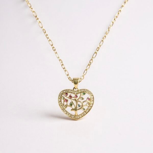 The Cuore di Famiglia necklace is a heartfelt tribute to love, heritage, and connection. Crafted with a gold-plated finish, this radiant heart-shaped pendant features a delicate family tree motif accented with colorful stones, each symbolizing life’s many blessings. Surrounded by a shimmering border of crystals, this piece captures both elegance and sentiment, making it a perfect keepsake for yourself or as a meaningful gift. A timeless reminder that family is at the heart of everything.