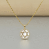 The Stella di Luna Necklace is a radiant tribute to the Star of David, crafted in luminous gold plating with a lustrous mother-of-pearl inlay. The six-pointed star — a timeless symbol of faith, protection, and divine balance — is encircled with a halo of sparkling crystals, reflecting moonlit brilliance. Designed to capture both elegance and meaning, this necklace celebrates heritage while exuding modern sophistication. Whether worn as a statement of devotion or a keepsake of tradition, it shines with enduring beauty.