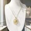The Luna Rosa Necklace is a romantic fusion of celestial glow and timeless beauty. Framed in an oval of luminous mother-of-pearl and shimmering crystals, it features a golden rose at its heart, plated in radiant gold for a touch of everlasting elegance. Symbolizing love, femininity, and grace, this piece transitions seamlessly from day to night, making it a treasured addition to any jewelry collection.