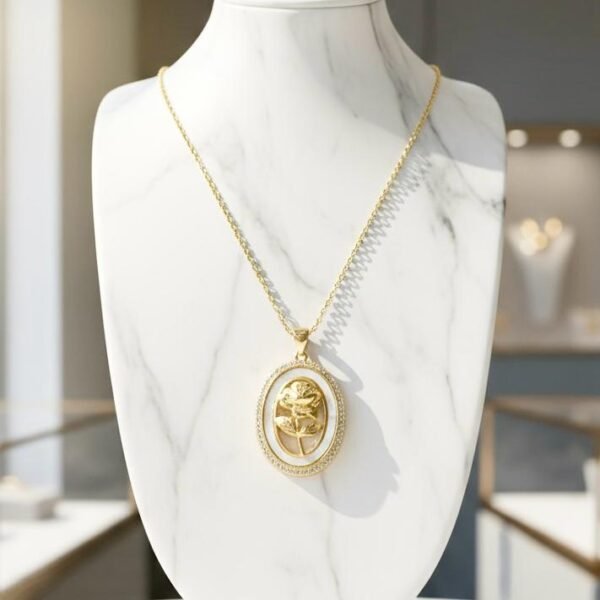 The Luna Rosa Necklace is a romantic fusion of celestial glow and timeless beauty. Framed in an oval of luminous mother-of-pearl and shimmering crystals, it features a golden rose at its heart, plated in radiant gold for a touch of everlasting elegance. Symbolizing love, femininity, and grace, this piece transitions seamlessly from day to night, making it a treasured addition to any jewelry collection.