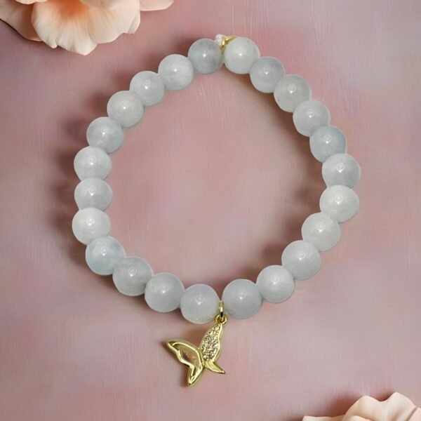 The Farfalla Bracelet is a celebration of renewal and elegance. Featuring radiant blue beads symbolizing harmony and growth, it is adorned with a delicate gold-plated butterfly charm accented with shimmering stones. The butterfly, or farfalla in Italian, is a timeless emblem of transformation, freedom, and beauty. A versatile piece designed to uplift any look, it carries both style and meaning.