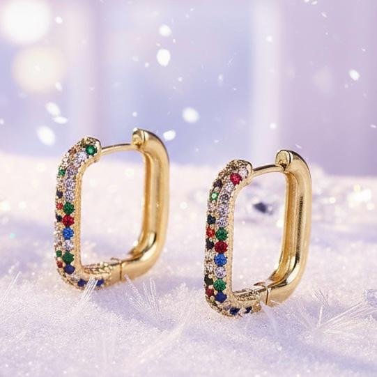 Colors of faith, lights of hope. Bring a burst of color to your everyday style with the Arcobaleno Earrings, a celebration of vibrant beauty. Crafted in gold-plated brass, these rectangular hoops are adorned with multicolored crystal stones that sparkle with every movement. Perfect for both casual chic and evening glamour, they add a playful yet elegant touch to your look. Lightweight, versatile, and radiant, the Arcobaleno Earrings are the perfect accessory to brighten your day.