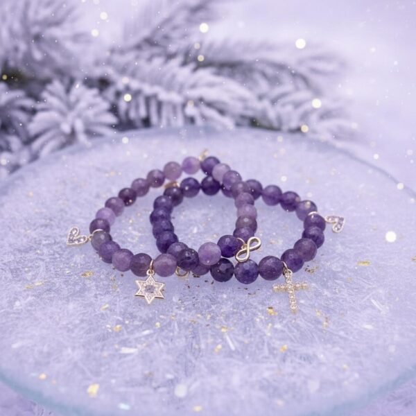 Faith bringing together a lifelong friendship. The Fede di Carolyn bracelet is a celebration of devotion, love, and lifelong friendship. Handcrafted with faceted amethyst stones, each bead carries calming and spiritual energy, symbolizing peace, clarity, and strength. The design is completed with three meaningful charms: A sparkling gold-plated cross framed with crystals, representing unwavering faith, a delicate light amethyst heart charm set in gold-plating, symbolizing pure love and compassion, and a gold-plated infinity symbol for eternity. This bracelet is a timeless reminder of unbreakable bonds and cherished connections.