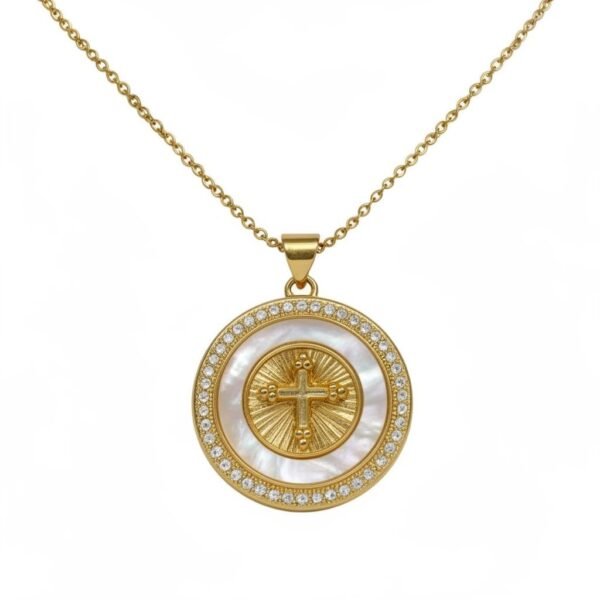 "Luce di Fede" A radiant symbol of devotion and strength. The Luce di Fede Necklace is a luminous expression of faith and elegance. Crafted with a radiant gold-plated setting, the round medallion showcases a central cross embraced by shimmering mother-of-pearl and encircled with a halo of sparkling crystals. This timeless design captures both spiritual devotion and refined sophistication, making it a versatile piece for daily wear or special occasions. A beautiful reminder of inner strength, guidance, and enduring light.
