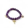 "Fede di Carolyn - Curo" Faith bringing together a lifelong friendship. The Fede di Carolyn bracelet is a celebration of devotion, love, and lifelong friendship. Handcrafted with faceted amethyst stones, each bead carries calming and spiritual energy, symbolizing peace, clarity, and strength. The design is completed with three meaningful charms: A sparkling gold-plated cross framed with crystals, representing unwavering faith, a delicate light amethyst heart charm set in gold-plating, symbolizing pure love and compassion, and a gold-plated infinity symbol for eternity. This bracelet is a timeless reminder of unbreakable bonds and cherished connections.