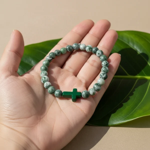 Grounded in purpose and guided by belief, the Verde Croce Bracelet brings meaningful style to everyday life. Handcrafted with natural green jasper stones, known for their grounding and stabilizing energy, this bracelet promotes balance, strength, and inner peace. At its heart lies a striking green stone cross, symbolizing unwavering faith and spiritual connection. Whether worn alone or stacked, this versatile piece blends earthy charm with inspirational elegance—perfect for both men and women.