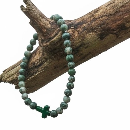Grounded in purpose and guided by belief, the Verde Croce Bracelet brings meaningful style to everyday life. Handcrafted with natural green jasper stones, known for their grounding and stabilizing energy, this bracelet promotes balance, strength, and inner peace. At its heart lies a striking green stone cross, symbolizing unwavering faith and spiritual connection. Whether worn alone or stacked, this versatile piece blends earthy charm with inspirational elegance—perfect for both men and women.