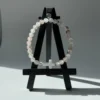 The Serenity Cross Bracelet is a minimalist expression of faith and inner peace. Handcrafted with smooth white agate gemstones, this bracelet embodies balance, grounding, and calm energy. At its center rests a sleek white cross bead, symbolizing guidance, hope, and divine protection. Its soft neutral palette makes it a beautiful and versatile accessory for both men and women, perfect for everyday wear, prayer, or meaningful gifting. Whether worn alone or stacked, it carries a message close to the heart—simple, spiritual, and sincere.