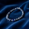 Discover effortless protection with the Azzuro Guard Bracelet—a modern take on ancient symbolism. Handcrafted with deep sapphire-blue sodalite stones, this bracelet represents clarity, intuition, and emotional balance. At its heart is the striking blue evil eye bead, a timeless symbol believed to shield against negativity and invite peace and good fortune. Versatile and powerful, this unisex bracelet transitions seamlessly from casual weekends to everyday wear. Whether worn alone or stacked, it’s a bold reminder to move through life with confidence and purpose.
