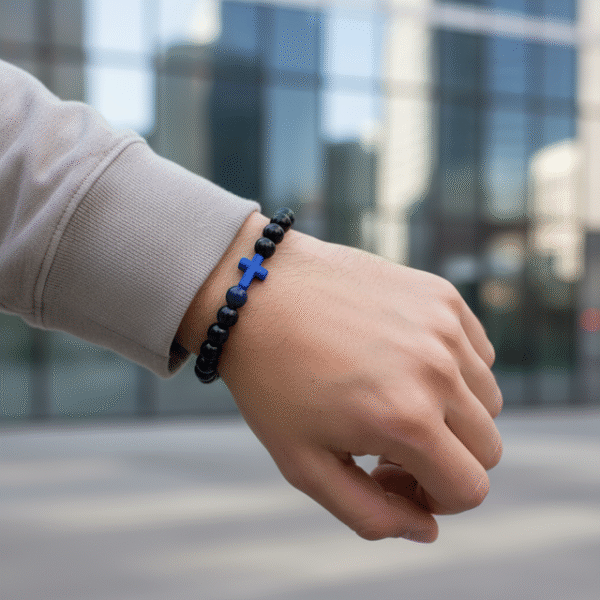 The Croce Azzurra bracelet blends bold faith with modern masculinity. Crafted with deep navy-blue natural stone beads and anchored by a striking azzurro (blue) cross, this piece carries purpose and power. The color blue symbolizes wisdom, protection, and confidence—making it more than just a bracelet, but a reflection of inner strength and belief. Designed for everyday wear, it elevates casual looks and pairs effortlessly with a watch or layered pieces. Whether you're stepping into the office, the gym, or a night out, Croce Azzurra keeps your faith close and your style sharp.