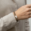Grounded in natural beauty and spiritual meaning, the Croce Terra Bracelet blends earthy tones with a timeless symbol of faith. Handcrafted with natural jasper gemstone beads, each stone reflects the rugged beauty of nature and carries a grounding energy that inspires balance, courage, and calm. The bracelet is centered with a handcrafted white cross bead—an elegant reminder of faith and purpose. Designed for everyday wear, Croce Terra offers a minimalist style that pairs effortlessly with any look—casual, professional, or spiritual. Made with a comfortable stretch design to fit most wrists, it's perfect as a personal keepsake or a thoughtful gift of meaningful style.