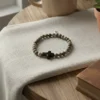 The Croce di Terra Bracelet is crafted with natural Jasper stone beads, celebrated for their earthy tones and grounding energy. At its heart lies a bold matte black cross—an emblem of strength, hope, and devotion. Whether worn as a symbol of faith or style, this bracelet carries quiet confidence and timeless character. Handmade with care and designed for everyday wear, Croce di Terra brings together modern minimalism and rugged authenticity. Perfect on its own or stacked, it’s a meaningful accessory for those who stay true to their path.