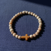 Inspired by the warm tones of sunlit desert sands, the Croce Sabbiosa Bracelet blends natural beauty with meaningful design. Featuring smooth cream-and-sand gemstone beads paired with a caramel-hued cross centerpiece, this bracelet brings a grounded, peaceful energy to everyday wear. Handcrafted with care, it’s a subtle yet powerful expression of faith, purpose, and style. The neutral palette makes it effortlessly versatile—perfect for both men and women who appreciate understated elegance with spiritual depth.