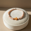 Inspired by the warm tones of sunlit desert sands, the Croce Sabbiosa Bracelet blends natural beauty with meaningful design. Featuring smooth cream-and-sand gemstone beads paired with a caramel-hued cross centerpiece, this bracelet brings a grounded, peaceful energy to everyday wear. Handcrafted with care, it’s a subtle yet powerful expression of faith, purpose, and style. The neutral palette makes it effortlessly versatile—perfect for both men and women who appreciate understated elegance with spiritual depth.