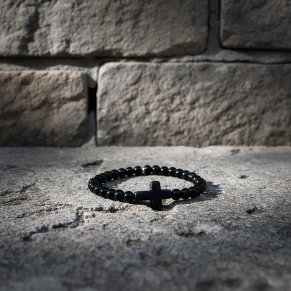 Embrace timeless simplicity with the Notte Nera bracelet, a unisex piece designed for those who value quiet strength and deep purpose. Handcrafted with polished black onyx beads and centered by a bold matte cross, this bracelet represents resilience, faith, and unwavering character. Its minimalist design makes it perfect for everyday wear—whether styled alone or stacked with other pieces. A reminder that true power speaks softly.