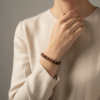 Inspired by the warm tones of the earth, the Terra Rosa bracelet is a tribute to natural beauty and inner strength. Handcrafted with polished Red Jasper gemstones, each bead carries unique patterns and grounding energy. Simple yet captivating, this piece complements both everyday style and quiet moments of reflection. A symbol of stability, courage, and feminine resilience, Terra Rosa is more than jewelry—it's a meaningful companion.