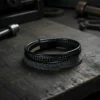Discover rugged refinement with the Nero Forge men’s bracelet — a bold fusion of power and style. Crafted with layered black genuine leather, including a braided centerpiece band, this bracelet brings together modern industrial design and masculine energy. The secure magnetic clasp ensures a strong fit while offering effortless wear. Perfect for daily styling or evening edge, Nero Forge is designed for the man who makes his mark without saying a word.