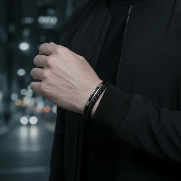 Bold yet refined, the Metallo Nero men’s bracelet delivers a modern statement of masculine style. Handcrafted from premium black braided leather and accented with a brushed stainless steel ID bar, this bracelet blends rugged durability with sleek urban sophistication. Designed for the man who values clean lines and timeless detail, it’s perfect for both everyday wear and special occasions. The secure magnetic clasp ensures comfort and confidence all day long.