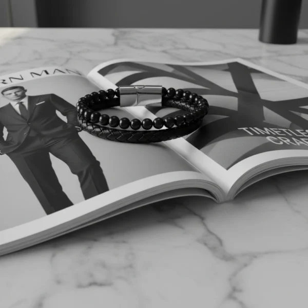 Meet the Nero Elite Bracelet, the embodiment of modern masculine elegance. Featuring a dual design of braided genuine leather and polished black onyx beads, this bracelet delivers a bold yet refined statement. The secure stainless steel magnetic clasp ensures durability and ease of wear, making it the perfect companion for both business attire and casual looks. Designed for men who appreciate timeless style and subtle sophistication, Nero Elite is more than an accessory—it's a signature.