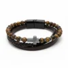 Grounded in character and built for purpose, the Terra Forte Bracelet blends rugged masculinity with timeless meaning. Crafted with genuine tiger’s eye beads, braided leather, and a dark hematite cross centerpiece, this multi-layer bracelet embodies resilience and conviction. Tiger’s eye is known as a stone of courage and focus, while the cross symbolizes inner faith and purpose. Designed for the modern man—confident, bold, and unwavering. Perfect for everyday wear, office style, or meaningful gifting.