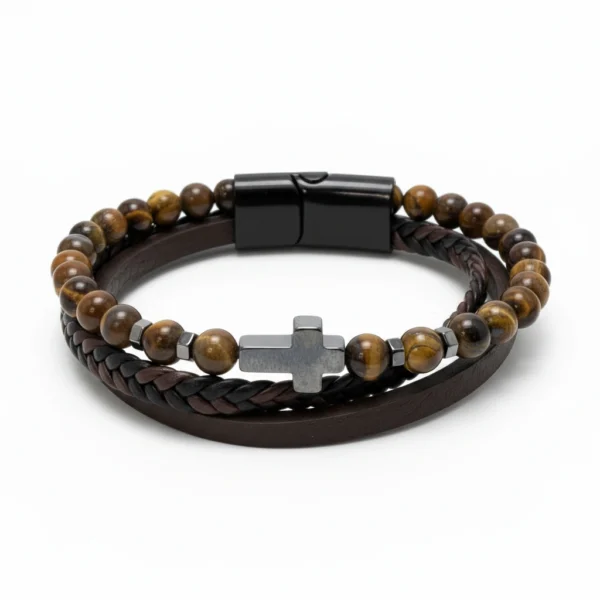 Grounded in character and built for purpose, the Terra Forte Bracelet blends rugged masculinity with timeless meaning. Crafted with genuine tiger’s eye beads, braided leather, and a dark hematite cross centerpiece, this multi-layer bracelet embodies resilience and conviction. Tiger’s eye is known as a stone of courage and focus, while the cross symbolizes inner faith and purpose. Designed for the modern man—confident, bold, and unwavering. Perfect for everyday wear, office style, or meaningful gifting.