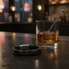 Discover Sabbia Nera, a rugged yet refined men's bracelet crafted for those who walk with purpose. Featuring natural matte stone beads paired with hand-braided genuine leather, this layered design embodies resilience and grounded strength. The sleek magnetic stainless steel clasp ensures durability and easy wear, making it a bold companion from the mountains to the city streets. Whether worn alone or stacked, Sabbia Nera reflects timeless style rooted in authenticity.