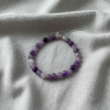 Embrace serenity with the Viola Tranquilla bracelet, a soothing blend of natural amethyst and lavender-toned gemstones. Handcrafted to inspire peace and feminine elegance, this bracelet radiates calming energy and quiet strength. Perfect for mindful mornings, peaceful moments, or adding a touch of soft sophistication to any outfit. Designed for the woman who values inner balance and natural beauty.