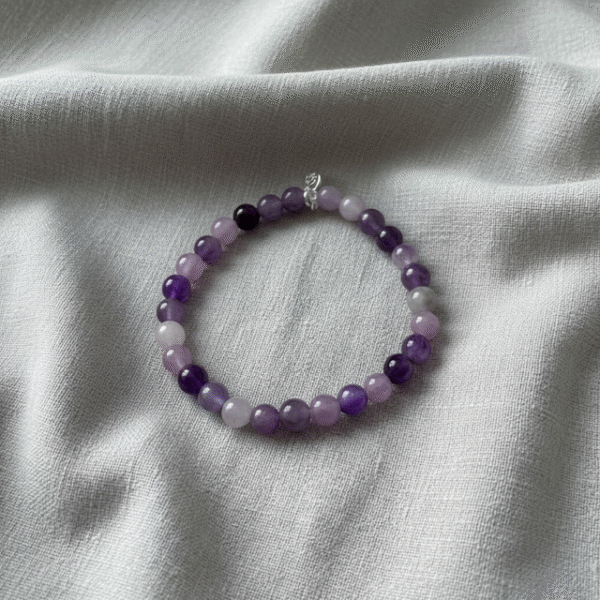 Embrace serenity with the Viola Tranquilla bracelet, a soothing blend of natural amethyst and lavender-toned gemstones. Handcrafted to inspire peace and feminine elegance, this bracelet radiates calming energy and quiet strength. Perfect for mindful mornings, peaceful moments, or adding a touch of soft sophistication to any outfit. Designed for the woman who values inner balance and natural beauty.