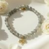 Graceful, grounding, and filled with meaning — the Albero di Luce bracelet is a symbol of growth, strength, and new beginnings. Handcrafted with shimmering natural grey labradorite beads, it's adorned with a delicate gold Tree of Life charm that celebrates connection to nature and inner balance. The soft glow of each bead reflects subtle flashes of light—gentle reminders to stay rooted while reaching toward your dreams. Elegant enough for special occasions and meaningful enough for everyday wear, this bracelet is a modern talisman for the soul.