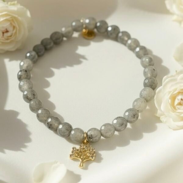 Graceful, grounding, and filled with meaning — the Albero di Luce bracelet is a symbol of growth, strength, and new beginnings. Handcrafted with shimmering natural grey labradorite beads, it's adorned with a delicate gold Tree of Life charm that celebrates connection to nature and inner balance. The soft glow of each bead reflects subtle flashes of light—gentle reminders to stay rooted while reaching toward your dreams. Elegant enough for special occasions and meaningful enough for everyday wear, this bracelet is a modern talisman for the soul.