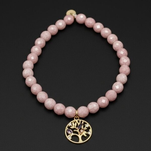 Handcrafted with genuine natural Rose Quartz gemstones and finished with a gold-plated Tree of Life charm, Fior di Sogni is a bracelet that celebrates love, healing, and inner peace. Known as the stone of unconditional love, Rose Quartz radiates calming energy and emotional harmony, while the Tree of Life symbolizes strength, growth, and connection. A meaningful piece of jewelry designed to empower the heart and elevate your style with a soft, romantic glow. Perfect for gifting—or cherishing for yourself.