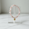 An eternal knot of love, strength, and unity. The Nodo Rosa Bracelet is a heartfelt tribute to the unbreakable bond between mother and daugthers. Handcrafted with radiant rose quartz stones, it radiates strength, clarity, and devotion. At its center rests a beautifully detailed gold plated knot charm — a timeless symbol of connection, loyalty, and love that can never be undone. Whether worn as a daily reminder of cherished family ties or as a statement of elegance, Nodo Rosa embodies both meaning and style. A piece that moves seamlessly from casual wear to evening elegance, it’s more than jewelry — it’s a story of family, heritage, and devotion.