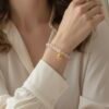 An eternal knot of love, strength, and unity. The Nodo Rosa Bracelet is a heartfelt tribute to the unbreakable bond between mother and daugthers. Handcrafted with radiant rose quartz stones, it radiates strength, clarity, and devotion. At its center rests a beautifully detailed gold plated knot charm — a timeless symbol of connection, loyalty, and love that can never be undone. Whether worn as a daily reminder of cherished family ties or as a statement of elegance, Nodo Rosa embodies both meaning and style. A piece that moves seamlessly from casual wear to evening elegance, it’s more than jewelry — it’s a story of family, heritage, and devotion.