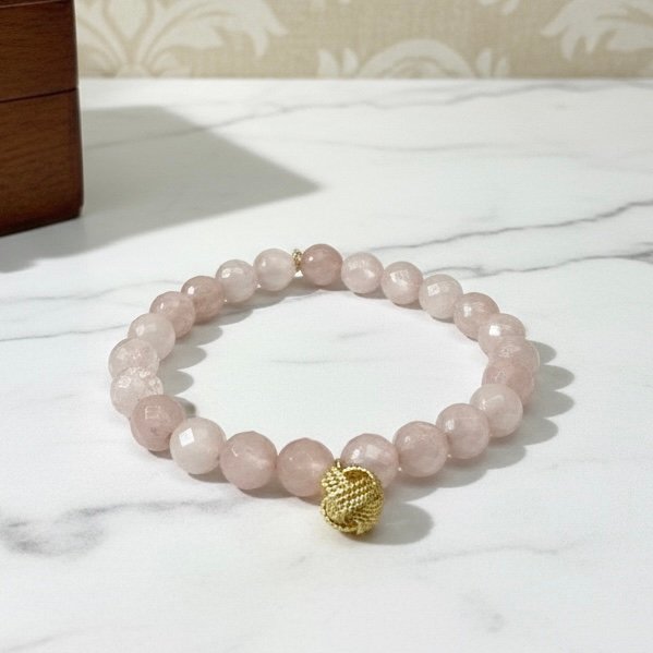 An eternal knot of love, strength, and unity. The Nodo Rosa Bracelet is a heartfelt tribute to the unbreakable bond between mother and daugthers. Handcrafted with radiant rose quartz stones, it radiates strength, clarity, and devotion. At its center rests a beautifully detailed gold plated knot charm — a timeless symbol of connection, loyalty, and love that can never be undone. Whether worn as a daily reminder of cherished family ties or as a statement of elegance, Nodo Rosa embodies both meaning and style. A piece that moves seamlessly from casual wear to evening elegance, it’s more than jewelry — it’s a story of family, heritage, and devotion.
