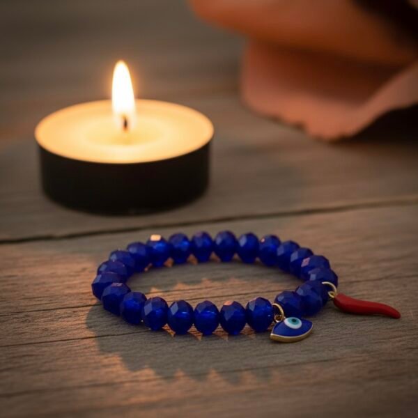 Elegant protection meets refined Italian charm. The Occhio Blu bracelet is handcrafted using faceted royal blue crystal beads that catch the light with every movement, symbolizing clarity and intuition. Featuring a gold-plated evil eye for protection against negativity and the red Cornetto horn symbolizing good luck and strength, this bracelet blends meaning with modern sophistication. Wear it as your everyday guardian or layer it for a bold Mediterranean look — either way, Occhio Blue keeps style and intention close at hand.