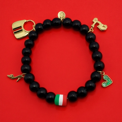Celebrate your passion, personality, and Italian soul with Spirito Libero. This luxurious charm bracelet blends modern style with Italian heritage for a bold, expressive statement. Designed using polished black onyx beads—known for strength and grounding—it features premium gold-plated charms that tell a story of freedom, adventure, and unmistakable Italian flair. From the tricolor bead symbolizing Italia to unique charms like the Vespa scooter, stiletto heel, heart, and luxury handbag, every detail reflects la dolce vita—confidence, romance, and passion for life. Whether you're elevating your everyday style or honoring your roots, this bracelet is a masterpiece of personality.