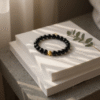 Bold. Refined. Unapologetically powerful. The Nero Reale bracelet blends minimalist luxury with timeless Italian elegance. Handcrafted using premium polished black onyx beads—known for their grounding energy and inner strength—this piece features a single 24k gold-plated accent bead as a symbol of purpose and prestige. A tribute to quiet confidence, this bracelet is made for those who lead by presence, not noise. Whether worn alone or stacked, Nero Reale delivers elevated style for every moment—from boardroom to night out.