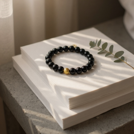 Bold. Refined. Unapologetically powerful. The Nero Reale bracelet blends minimalist luxury with timeless Italian elegance. Handcrafted using premium polished black onyx beads—known for their grounding energy and inner strength—this piece features a single 24k gold-plated accent bead as a symbol of purpose and prestige. A tribute to quiet confidence, this bracelet is made for those who lead by presence, not noise. Whether worn alone or stacked, Nero Reale delivers elevated style for every moment—from boardroom to night out.