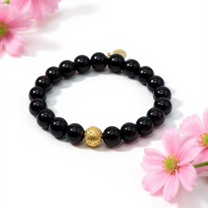 Bold. Refined. Unapologetically powerful. The Nero Reale bracelet blends minimalist luxury with timeless Italian elegance. Handcrafted using premium polished black onyx beads—known for their grounding energy and inner strength—this piece features a single 24k gold-plated accent bead as a symbol of purpose and prestige. A tribute to quiet confidence, this bracelet is made for those who lead by presence, not noise. Whether worn alone or stacked, Nero Reale delivers elevated style for every moment—from boardroom to night out.