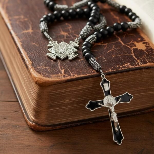 "Rosario di San Michele" Strength, courage, and divine protection. The Rosario di San Michele is a powerful symbol of faith, courage, and heavenly protection. Designed with deep black prayer beads, durable woven cord, and a striking silver-tone St. Michael medallion, this rosary honors the Defender of Heaven—protector against harm, fear, and darkness. A bold black-and-silver crucifix completes the design, creating a meaningful devotional piece for daily prayer, meditation, or spiritual grounding. Whether kept close during life’s hardest battles or gifted to someone in need of strength, this rosary serves as a reminder that you never walk alone—Saint Michael walks beside you. Perfect for men, women, and teens seeking a strong, traditional, and beautifully crafted rosary.