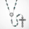 "Santiago di Smeraldo Rosary" Path of Faith. The Santiago di Smeraldo Rosary is a beautifully crafted devotional piece inspired by the historic Camino de Santiago pilgrimage. Designed with shimmering emerald-toned glass beads and ornate silver filigree caps, this rosary captures the spirit of faith, strength, and spiritual journey. At the center, a detailed Santiago emblem honors the tradition of the Way of St. James, while the intricately designed crucifix adds a timeless touch of reverence. Each bead is thoughtfully spaced and linked, offering a smooth, calming flow through every prayer. Whether gifted to a loved one or kept as a treasured personal sacramental, this rosary is a meaningful companion for prayer, reflection, and the journeys of life. Perfect for: devotion, gifting, confirmation, spiritual encouragement, and collectors of meaningful religious pieces.