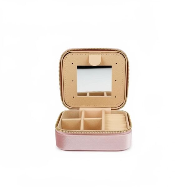 "Grazia da Viaggio" Elegance that travels with you. Meet Grazia da Viaggio Organizer, your new must-have travel companion for keeping jewelry beautifully organized wherever life takes you. Crafted in soft blush velvet with a luxe satin finish, this compact organizer opens to reveal a smart, multi-section interior: divided compartments for earrings and pendants, cushioned ring slots, and a built-in mirror for effortless touch-ups on the go. The secure zip-around closure protects your favorite pieces from tangles and scratches, while the lightweight design makes it perfect for handbags, carry-ons, gym bags, or weekend trips. Practical, pretty, and travel-ready, Grazia da Viaggio Organizer brings effortless elegance to every journey. Dimensions: 3.93" × 1.96" Features: Ring rolls, earrings slots, multi-use open compartments, built-in mirror, secure zipper