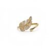 "Foglia Dorata" Nature’s elegance, reimagined in gold. The Foglia Dorata ring captures the delicate beauty of nature in a fashion-forward design. Crafted in gold-plated brass, this adjustable ring showcases a sparkling pavé crystal leaf that wraps gracefully around your finger. Its open band ensures a comfortable fit while adding a touch of modern sophistication. A perfect piece for layering or wearing solo, this ring embodies effortless glamour and everyday versatility. Whether worn casually or as a statement accessory, the Foglia Dorata Ring is a timeless expression of natural beauty elevated with radiant sparkle.