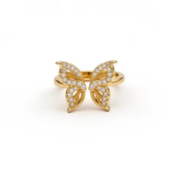 "Farfalla" A golden embrace where wings meet light, and timeless grace. The Farfalla Ring captures the delicate beauty of a butterfly in flight, symbolizing transformation, lightness, and freedom. Crafted in gold-plated brilliance and adorned with sparkling stones, its wings shimmer with every movement, offering a perfect blend of elegance and radiance. A timeless piece that celebrates grace and resilience, Farfalla is designed to inspire and enchant. This ring is more than jewelry; it’s a gesture of compassion. A portion of the proceeds from every Farfalla ring is donated to JAR of Hope, supporting research and awareness in the fight against Duchenne Muscular Dystrophy. Wear it as a reminder that every step forward is a flight toward hope.