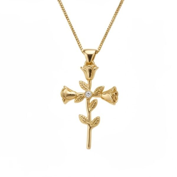 "Rosario " Devotion blooms like a rose. The Rosario Mini Necklace is a delicate expression of faith, love, and timeless beauty. Crafted in radiant gold plating, this refined pendant features a petite cross formed from softly sculpted rose blooms, each petal symbolizing devotion, grace, and eternal love. At its center, a gently sparkling stone adds a touch of light, creating a subtle brilliance that elevates the design while preserving its meaningful simplicity. Smaller in scale yet rich in symbolism, Rosario Mini is designed to be worn close to the heart, making it perfect for everyday wear or special moments. Elegant on its own and beautiful when layered, the Rosario Mini Necklace is a heartfelt keepsake for those who wish to carry faith and grace with them always.