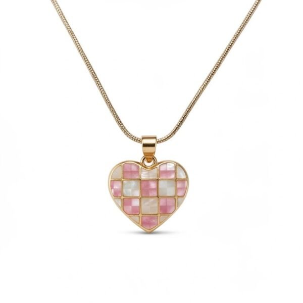 "Cuore Rosa" Love, softly illuminated. The Cuore Rosa Mosaic Necklace is a radiant expression of love and feminine elegance. Crafted in luminous gold plating, this heart-shaped pendant features a delicate mosaic of soft blush pink and iridescent mother-of-pearl tiles, creating a gentle interplay of color and light. Each piece reflects subtle variations, giving the necklace a handcrafted feel that feels both timeless and modern. The glowing heart silhouette symbolizes love, warmth, and emotional connection—designed to be worn close to the heart. Perfect worn alone as a romantic statement or layered with other Bella Pia favorites, the Cuore Rosa Mosaic Necklace transitions effortlessly from everyday moments to special occasions. A meaningful keepsake or thoughtful gift, it captures love in its most luminous form.