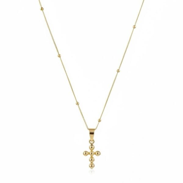 "Croce Aurea Necklace" Faith, refined in gold. The Croce Aurea Necklace is a timeless expression of faith and understated elegance. Crafted in radiant gold plating, this delicate cross pendant features softly rounded bead detailing, creating a gentle, luminous glow with every movement. Suspended from a slender gold-plated chain accented with subtle stations, the design feels light, graceful, and effortlessly wearable. Its minimalist silhouette allows the symbolism of the cross to shine—making it a meaningful piece for everyday devotion or a thoughtful, faith-filled gift. Designed to be worn alone or layered with other Bella Pia favorites, the Croce Aurea Necklace is a beautiful reminder that faith can be both powerful and elegantly simple.
