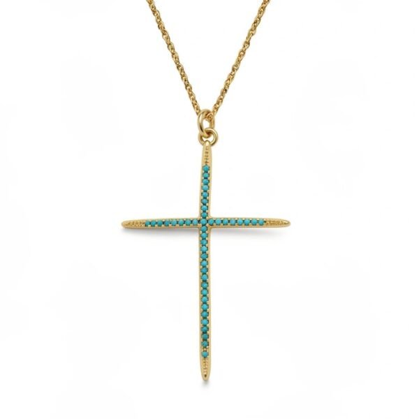 "Fede Turchese" Strength in faith, brilliance in turquoise. The Fede Turchese Necklace is a timeless emblem of devotion and inner calm. Crafted in a slender gold-plated frame, this elegant cross is adorned with luminous turchese (turquoise) stones, long associated with peace, clarity, and spiritual protection. Each stone is thoughtfully set to enhance the refined silhouette, allowing soft color and light to shine through. The serene turquoise hue brings balance and confidence, while the clean lines of the cross offer a modern yet reverent expression of faith. Perfect for everyday wear or as a meaningful gift, the Fede Turchese Necklace is a beautiful reminder that faith can be both powerful and quietly radiant.